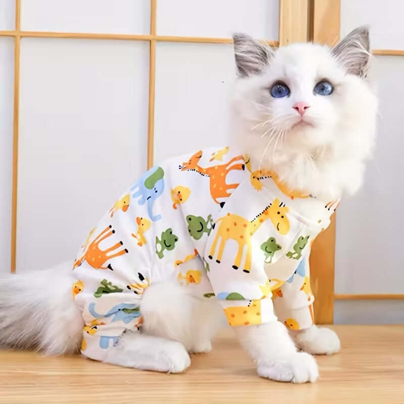 Cute pet sleepsuit on a fluffy cat with colorful animal prints, perfect for pets to wear comfortably.
